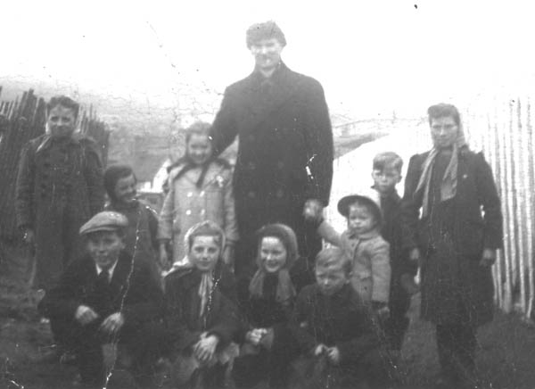 083: standing l-r Teresa Whelan, Rita Whelan, Mary Reddy, Fr Haverstrow, Anne Marie Barry,  Leo Barry, Marie Counsel; squatting, Cam Dunphy, Madonna Whelan, Gwen Carroll, Ray  Carroll. (circa 1948) [courtesy of Mary (Reddy) King]  - Teresa, Rita and Madonna daughters of Leo Whelan &amp;amp; Liz Bishop; Mary daughter of Michael  Reddy &amp;amp; Liz Moore; Cam son of Thomas Dunphy &amp;amp; Anne Carroll; Anne Marie daughter of Leo  Barry &amp;amp; Liz Ryan; Gwen, Ray and ? children of Michael Carroll &amp;amp; Josie Barry; Rosemary  daughter of William Whelan &amp;amp; Mary Carroll